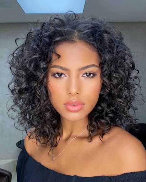 Thick curly hairstyles with an Off Center Part