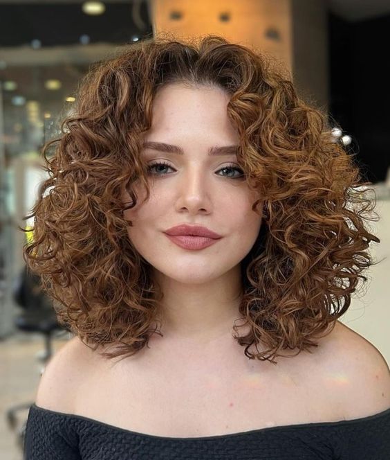 Thick curly hairstyles with an Off Center Part