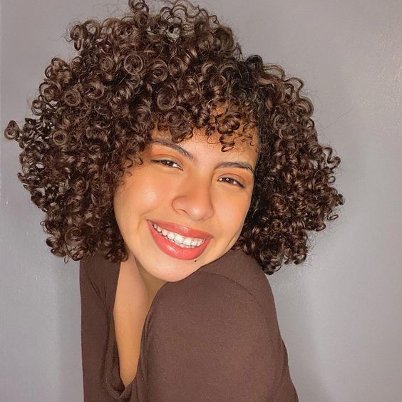For Naturally Curly Hairstyles 2023Medium Hair Blunt Cut With A Center Part