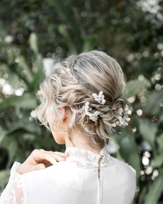 A Relaxed, Low Messy Bun With a Flower Crown
